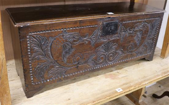 A later carved oak coffer W.117cm